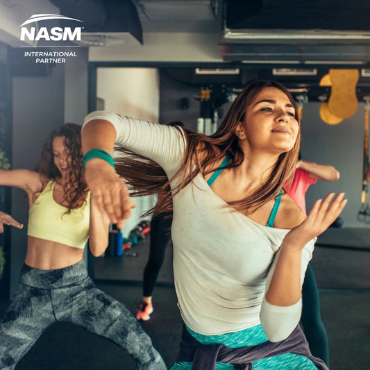 A group exercising in a gym with NASM International Partner logo.